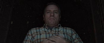 Movie still from “Raymond & Ray” (2022), directed by Rodrigo García – A person holding his hands on his chest; Close Up shot, Overhead angle