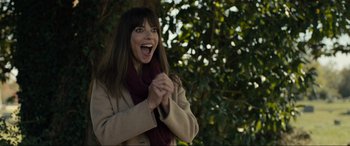 Movie still from “Raymond & Ray” (2022), directed by Rodrigo García – A beautiful woman wearing a coat and a scarf; Close Up shot, Low angle