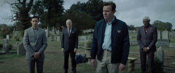 Movie still from “Raymond & Ray” (2022), directed by Rodrigo García – Two men standing in the grass next to each other; Medium shot, Over the shoulder angle