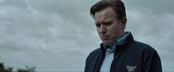 Movie still from “Raymond & Ray” (2022), directed by Rodrigo García – A person wearing a jacket; Close Up shot, Low angle