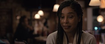 Movie still from “Raymond & Ray” (2022), directed by Rodrigo García – A person with long braids; Close Up shot, Over the shoulder angle