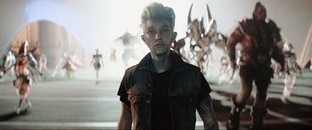 Movie still from “Ready Player One” (2018), directed by Steven Spielberg – A young man with blonde spiky hair wearing a jean jacket; Close Up shot, Over the shoulder angle