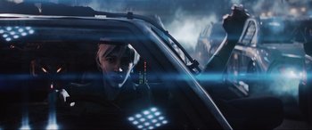 Movie still from “Ready Player One” (2018), directed by Steven Spielberg – A man in a car looking out of the window; Close Up shot, Over the shoulder angle