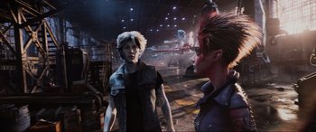 Movie still from “Ready Player One” (2018), directed by Steven Spielberg – A man with a red mohawk talks to another man in a black shirt; Medium shot, Over the shoulder angle