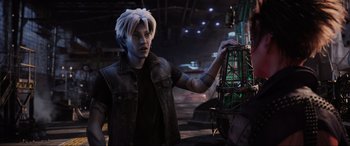Movie still from “Ready Player One” (2018), directed by Steven Spielberg – A man in a leather jacket holding onto a cage; Medium shot, Over the shoulder angle