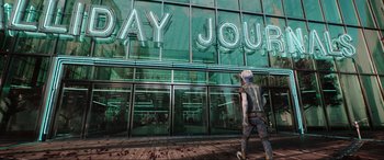 Movie still from “Ready Player One” (2018), directed by Steven Spielberg – A person walking in front of a large building; Wide shot, Low angle