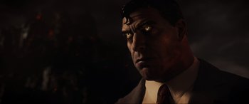 Movie still from “Ready Player One” (2018), directed by Steven Spielberg – A person wearing a suit and tie; Close Up shot, Over the shoulder angle