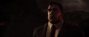 Movie still from “Ready Player One” (2018), directed by Steven Spielberg – A person wearing a suit and tie; Close Up shot, Low angle