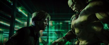 Movie still from “Ready Player One” (2018), directed by Steven Spielberg – A man and a woman face each other in a green room; Medium shot, Over the shoulder angle