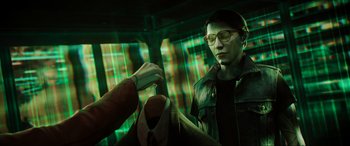 Movie still from “Ready Player One” (2018), directed by Steven Spielberg – A man in glasses and a leather jacket is holding a tie; Medium shot, Over the shoulder angle