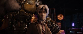 Movie still from “Ready Player One” (2018), directed by Steven Spielberg – A man in a suit and tie standing next to a robot; Close Up shot, Low angle