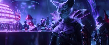 Movie still from “Ready Player One” (2018), directed by Steven Spielberg – A person with a cat mask on in a dark room; Medium shot, Over the shoulder angle