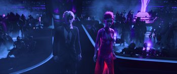Movie still from “Ready Player One” (2018), directed by Steven Spielberg – A man and a woman walking down a runway at a fashion show; Medium shot, Low angle