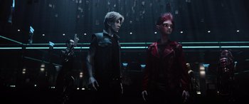 Movie still from “Ready Player One” (2018), directed by Steven Spielberg – A group of people standing next to each other in a room; Medium shot, Low angle