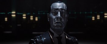 Movie still from “Ready Player One” (2018), directed by Steven Spielberg – A person wearing a suit and tie; Close Up shot, Low angle