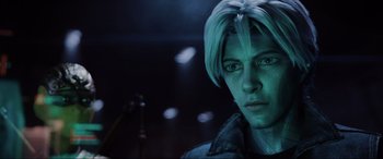 Movie still from “Ready Player One” (2018), directed by Steven Spielberg – A person wearing a jacket and looking at the camera; Close Up shot, Over the shoulder angle