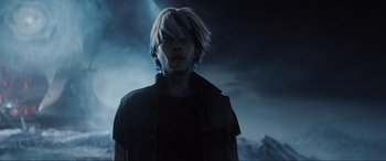 Movie still from “Ready Player One” (2018), directed by Steven Spielberg – A man in a black shirt is standing in front of a dark sky; Close Up shot, Low angle