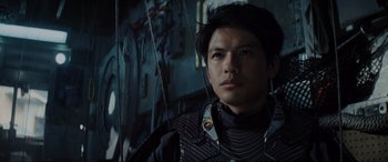 Movie still from “Ready Player One” (2018), directed by Steven Spielberg – A young man in a black shirt is looking at the camera; Close Up shot, Low angle