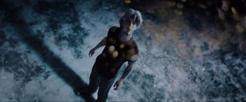 Movie still from “Ready Player One” (2018), directed by Steven Spielberg – A man standing in the middle of a room; Medium shot, Overhead angle