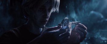 Movie still from “Ready Player One” (2018), directed by Steven Spielberg – A person holding a pocket watch in their hands; Close Up shot, High angle