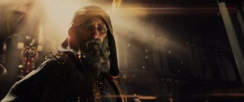 Movie still from “Ready Player One” (2018), directed by Steven Spielberg – An old man with a long beard wearing a turban; Close Up shot, Low angle