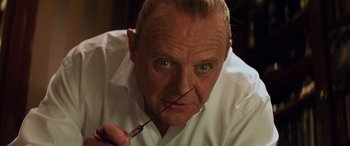 Movie still from “Red Dragon” (2002), directed by Brett Ratner – A person holding a pair of scissors; Close Up shot, Low angle