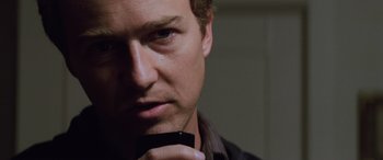 Movie still from “Red Dragon” (2002), directed by Brett Ratner – A person holding a cell phone; Close Up shot, Low angle