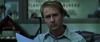 Movie still from “Red Dragon” (2002), directed by Brett Ratner – A person wearing a dress shirt; Close Up shot, Over the shoulder angle