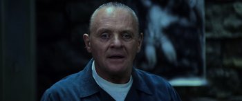 Movie still from “Red Dragon” (2002), directed by Brett Ratner – A person wearing a blue shirt; Close Up shot, Low angle