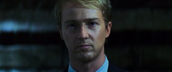 Movie still from “Red Dragon” (2002), directed by Brett Ratner – A person wearing a suit and tie; Close Up shot, Low angle