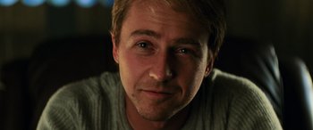 Movie still from “Red Dragon” (2002), directed by Brett Ratner – A man's face in a dark room; Close Up shot, Low angle