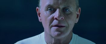 Movie still from “Red Dragon” (2002), directed by Brett Ratner – An older man with a white shirt is looking at the camera; Close Up shot, Low angle