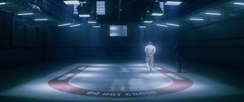 Movie still from “Red Dragon” (2002), directed by Brett Ratner – A man standing in a ring in the middle of a ring; Extreme Wide shot, High angle