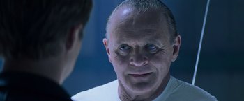 Movie still from “Red Dragon” (2002), directed by Brett Ratner – A person looking into a mirror; Close Up shot, Over the shoulder angle