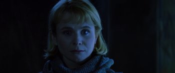 Movie still from “Red Dragon” (2002), directed by Brett Ratner – A young woman with blonde hair wearing a gray sweater; Close Up shot, Low angle