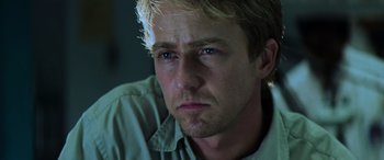 Movie still from “Red Dragon” (2002), directed by Brett Ratner – A man's face in a dark room; Close Up shot, Low angle