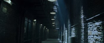 Movie still from “Red Dragon” (2002), directed by Brett Ratner – A dark hallway with lights hanging from the ceiling; Extreme Wide shot, High angle