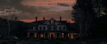 Movie still from “Red Dragon” (2002), directed by Brett Ratner – An old house with a cloudy sky in the background at night; Extreme Wide shot, Low angle