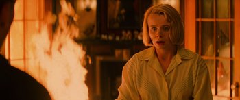 Movie still from “Red Dragon” (2002), directed by Brett Ratner – A woman standing in front of a fireplace; Close Up shot, High angle