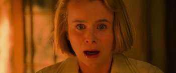 Movie still from “Red Dragon” (2002), directed by Brett Ratner – A young woman with short blonde hair looking surprised at the camera; Close Up shot, Low angle