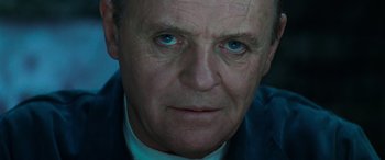 Movie still from “Red Dragon” (2002), directed by Brett Ratner – A man's face with blue eyes; Close Up shot, Low angle