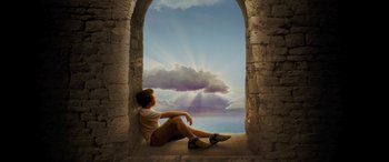 Movie still from “Redeeming Love” (2022), directed by D.J. Caruso – A person sitting on a ledge looking out at the sky; Wide shot, Low angle