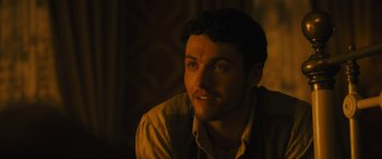 Movie still from “Redeeming Love” (2022), directed by D.J. Caruso – A person sitting in a room; Close Up shot, Over the shoulder angle