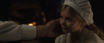 Movie still from “Redeeming Love” (2022), directed by D.J. Caruso – A woman putting a crown on a young girl's face; Close Up shot, Over the shoulder angle