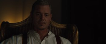 Movie still from “Redeeming Love” (2022), directed by D.J. Caruso – A person sitting in a chair wearing a white shirt; Close Up shot, Over the shoulder angle