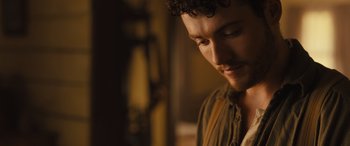 Movie still from “Redeeming Love” (2022), directed by D.J. Caruso – A person looking down at his face; Close Up shot, Over the shoulder angle