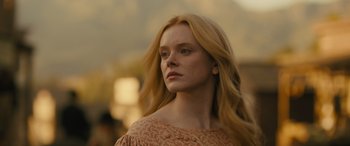 Movie still from “Redeeming Love” (2022), directed by D.J. Caruso – A beautiful young woman with long blonde hair and blue eyes; Close Up shot, Low angle