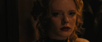 Movie still from “Redeeming Love” (2022), directed by D.J. Caruso – A person wearing a necklace; Close Up shot, Low angle