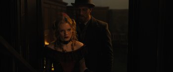 Movie still from “Redeeming Love” (2022), directed by D.J. Caruso – A man and a woman standing next to each other; Medium shot, Over the shoulder angle