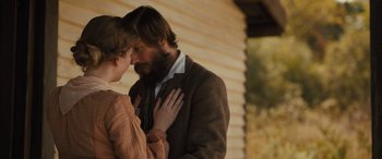 Movie still from “Redeeming Love” (2022), directed by D.J. Caruso – A man and a woman standing next to each other; Medium shot, Over the shoulder angle